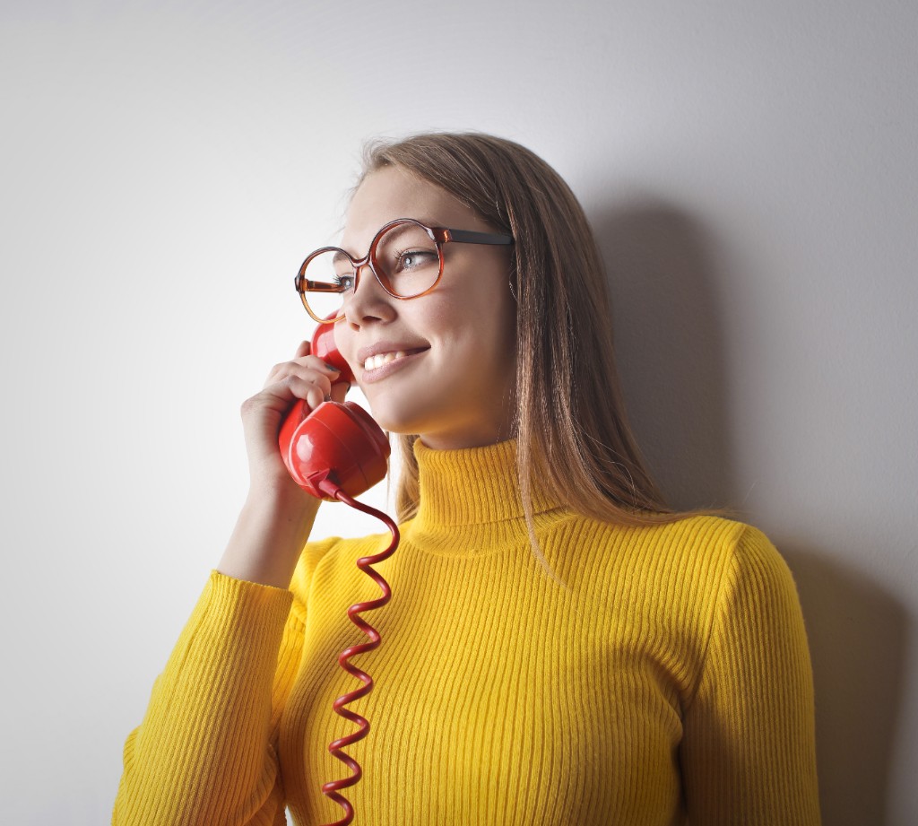Smiling intake specialist taking a live call from a new law firm prospect